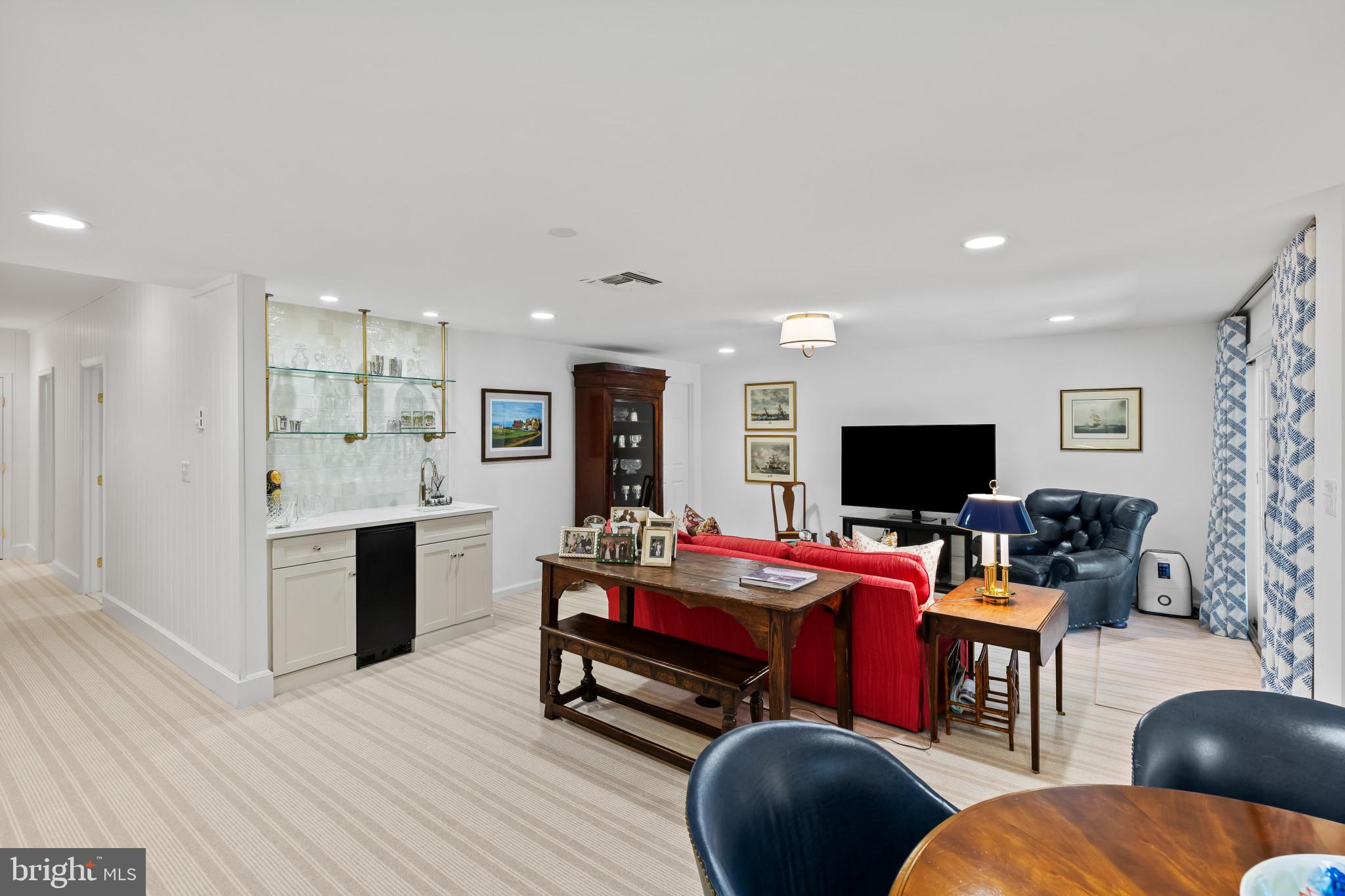 8027 Strauff Road, Unit 6 Towson, MD 21204 - Photo 23 of 39 a bedroom with furniture and a flat screen tv