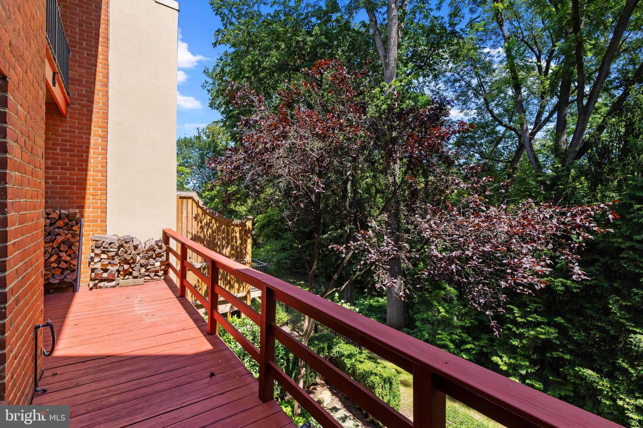 8027 Strauff Road, Unit 6 Towson, MD 21204 - Photo 30 of 39 a balcony with wooden floor and trees