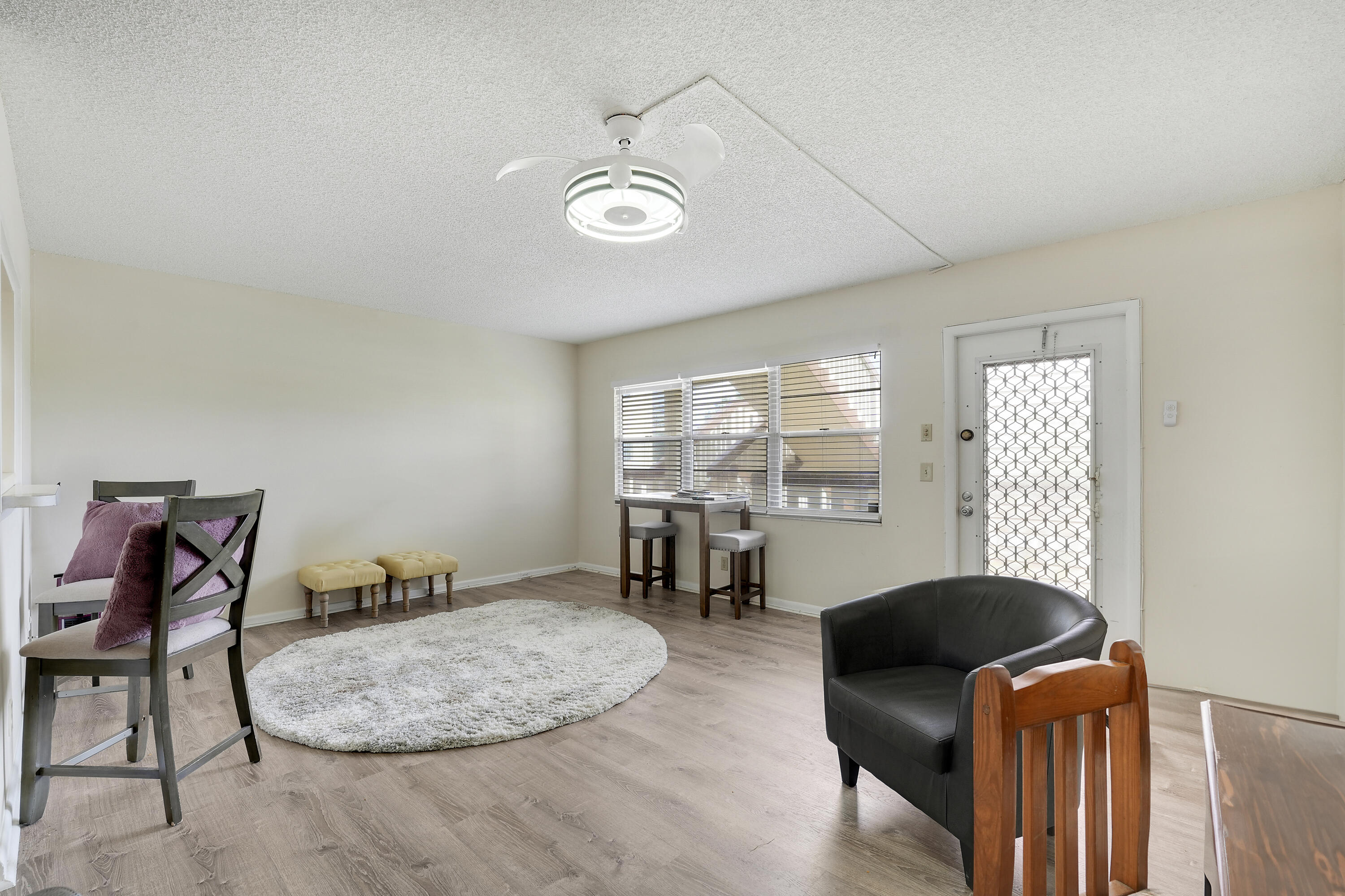 16 Mansfield B Boca Raton, FL 33434 - Photo 1 of 15 a living room with furniture and a fireplace