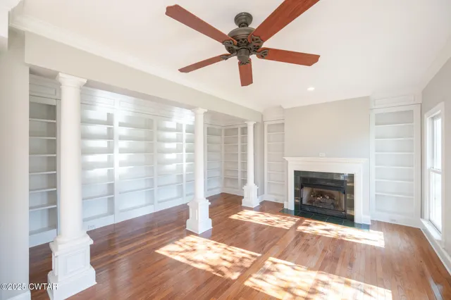 a bathroom with a granite countertop sink toilet a large mirror a bathtub and shower