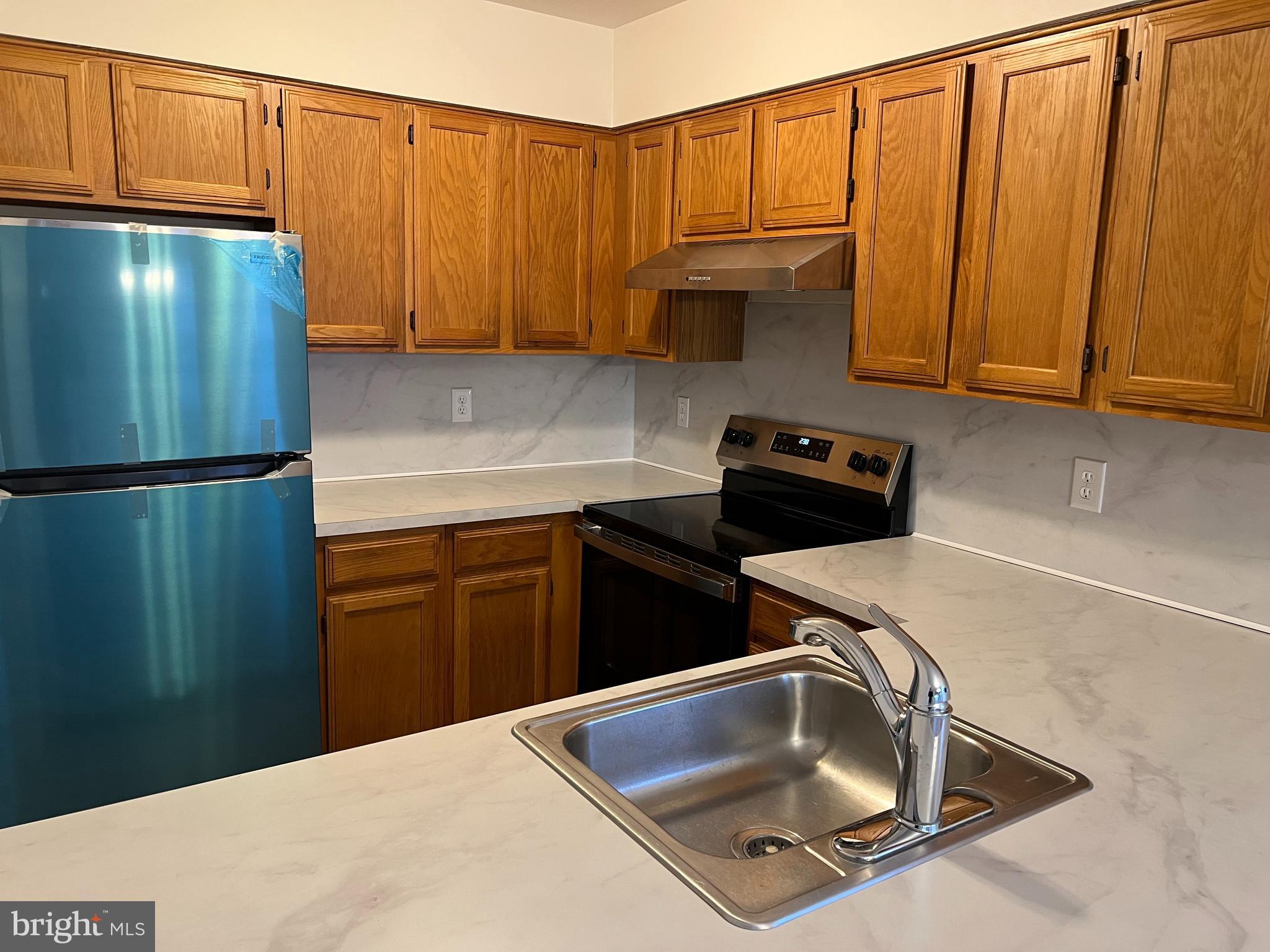 83 West Laurel Avenue Cheltenham, PA 19012 - Photo 5 of 19 a kitchen with a sink and cabinets