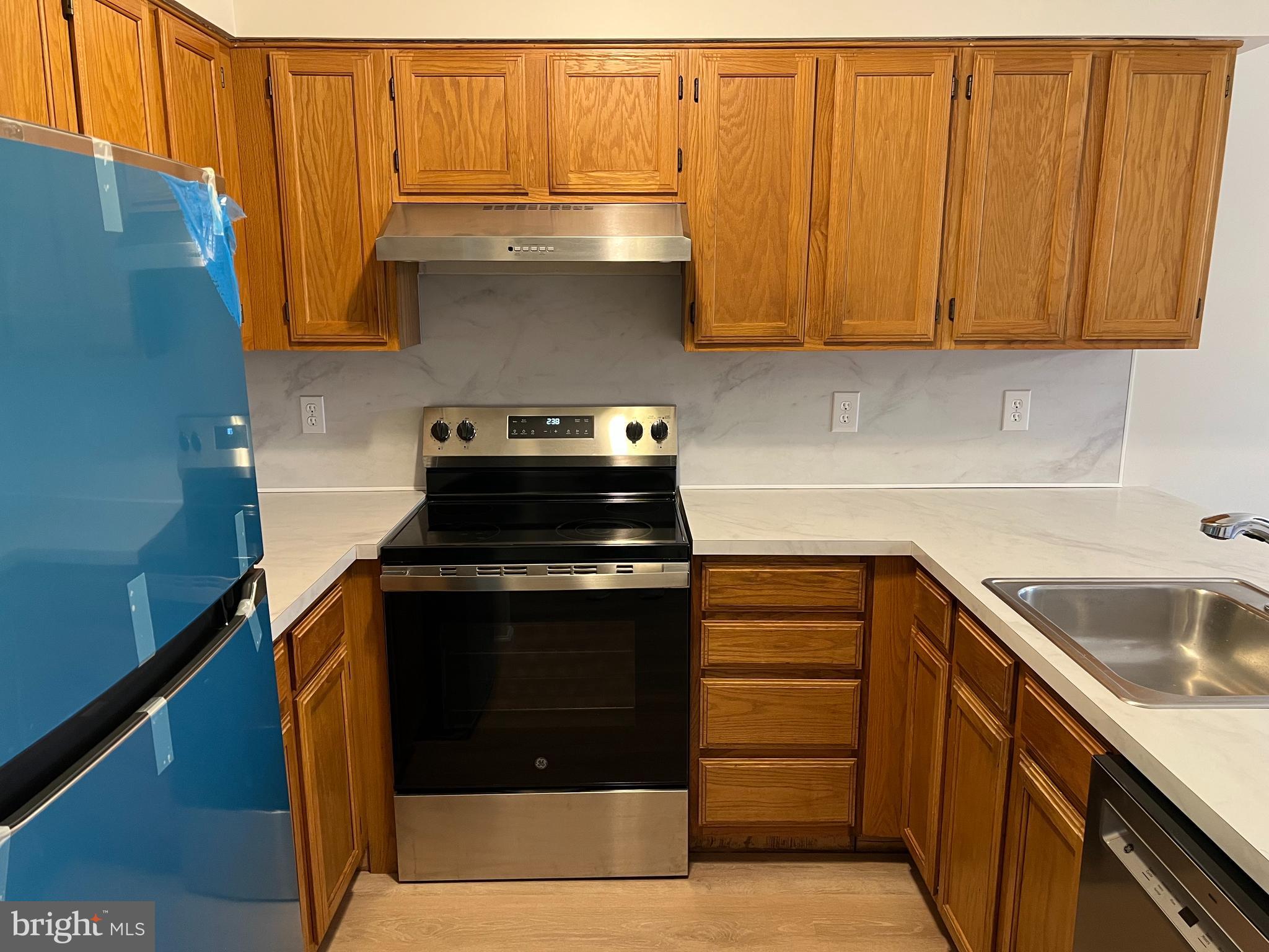 83 West Laurel Avenue Cheltenham, PA 19012 - Photo 6 of 19 a kitchen with stainless steel appliances granite countertop a stove and a sink