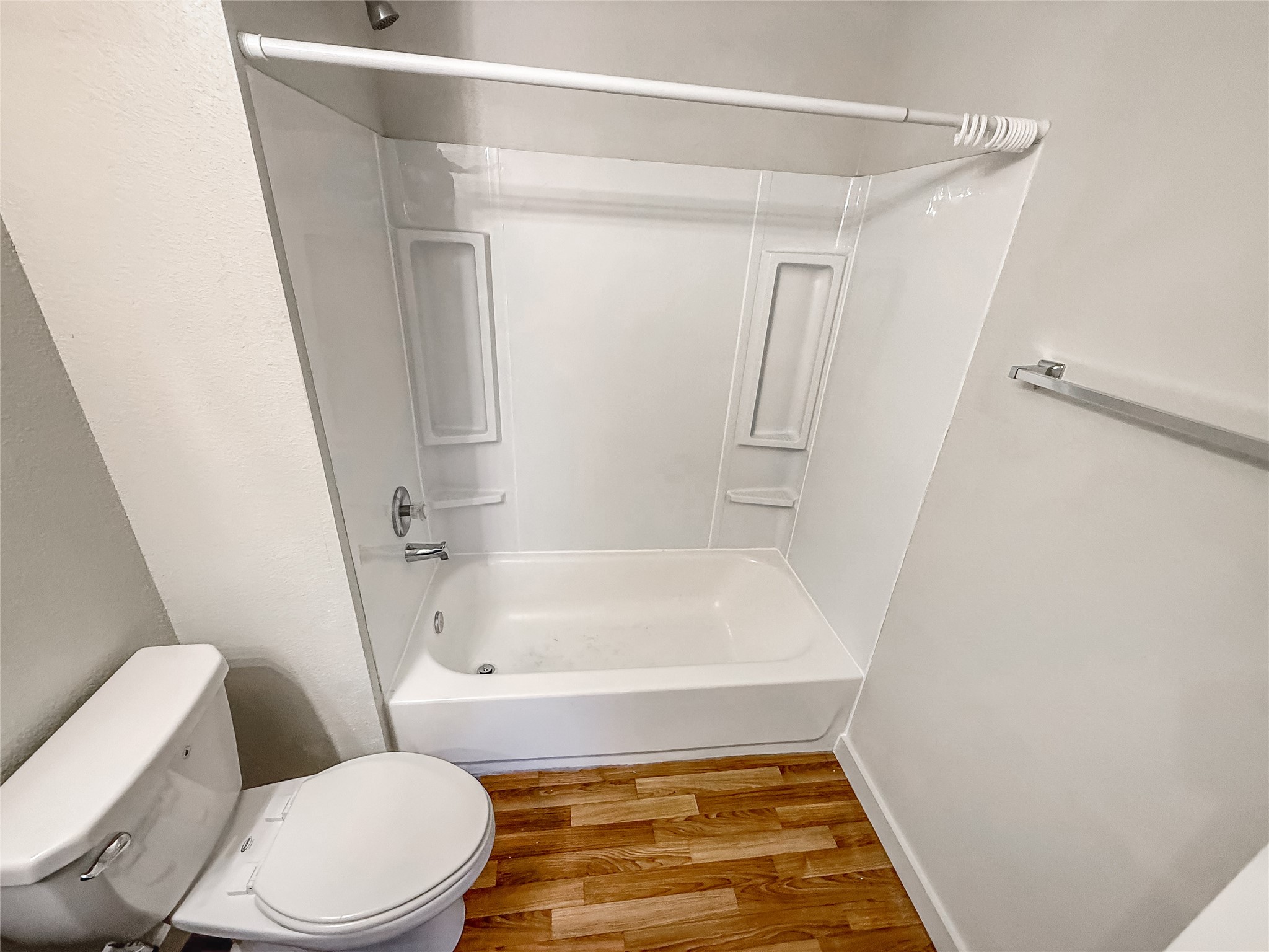 10535 Mills Road, Unit 4B Houston, TX 77070 - Photo 18 of 28 a bathroom with a toilet and a shower