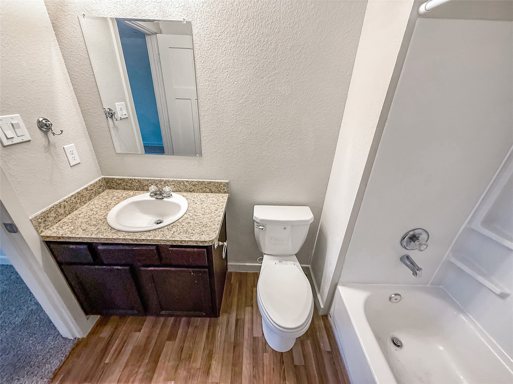 10535 Mills Road, Unit 4B Houston, TX 77070 - Photo 19 of 28 a bathroom with a sink and a mirror