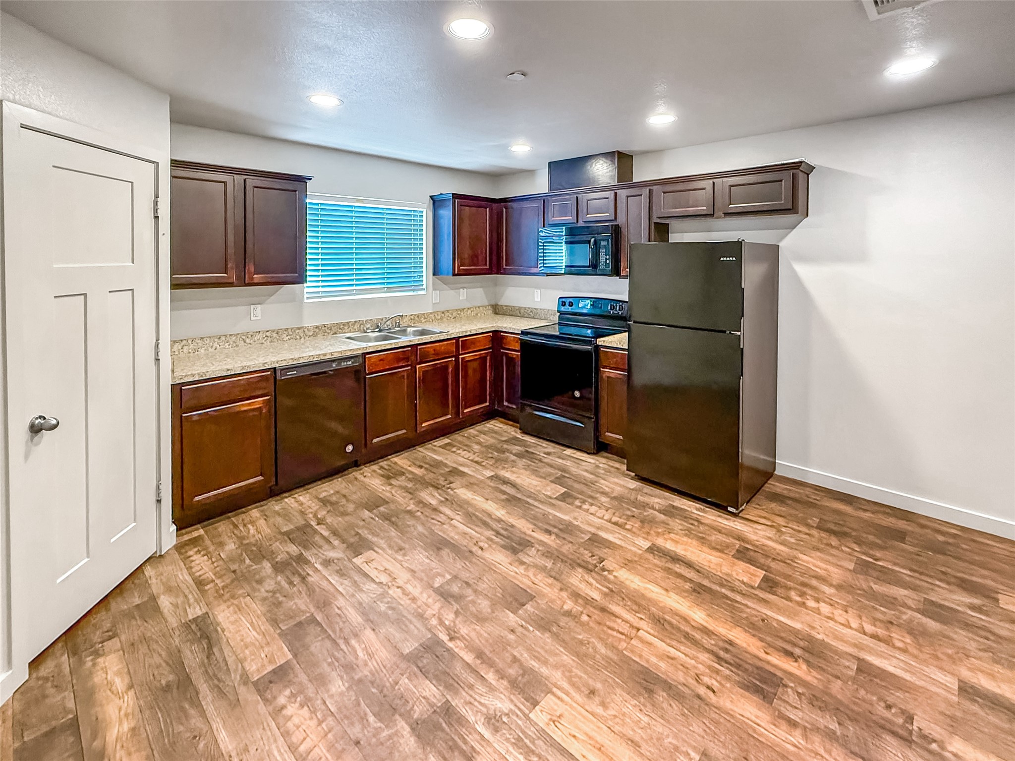 10535 Mills Road, Unit 4B Houston, TX 77070 - Photo 7 of 28 a kitchen with stainless steel appliances granite countertop a refrigerator and a stove