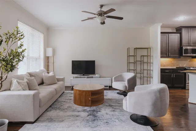a living room with furniture and a flat screen tv