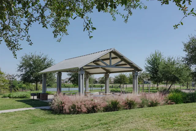 a front view of a house with garden and porch