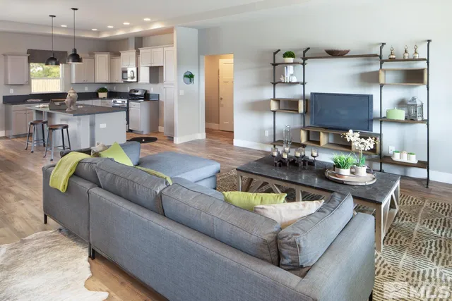 a living room with furniture and a table