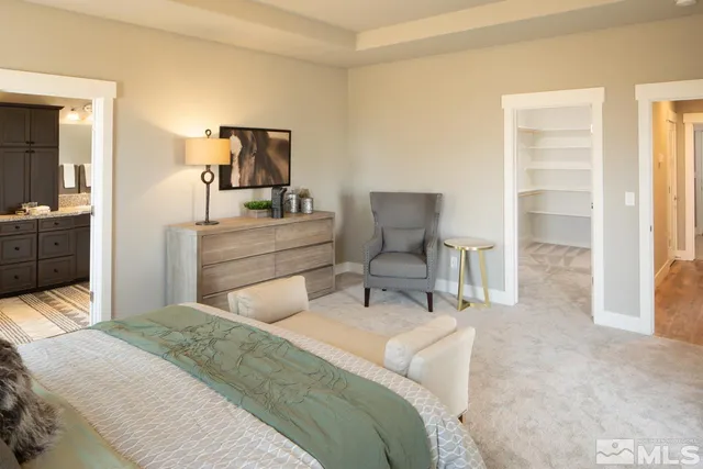 a bedroom with a bed and a mirror