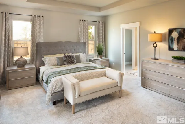 a bathroom with a granite countertop shower a sink and a mirror