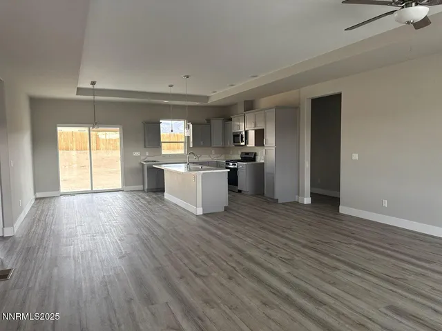a view of kitchen with sink and wooden floor