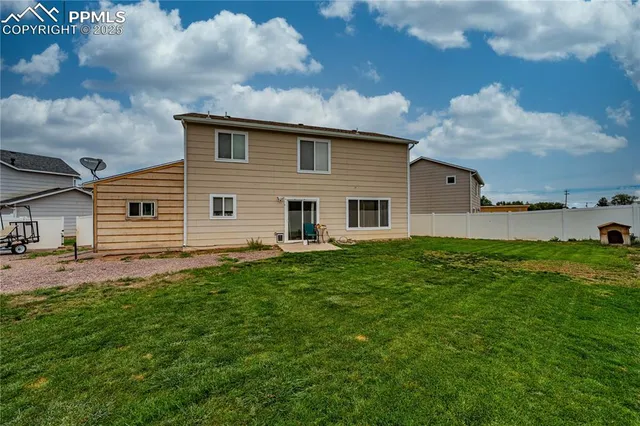 a view of a backyard of the house