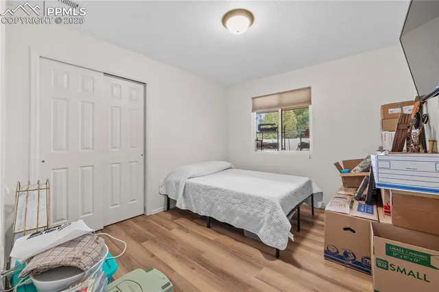 a bedroom with a bed and a table in it