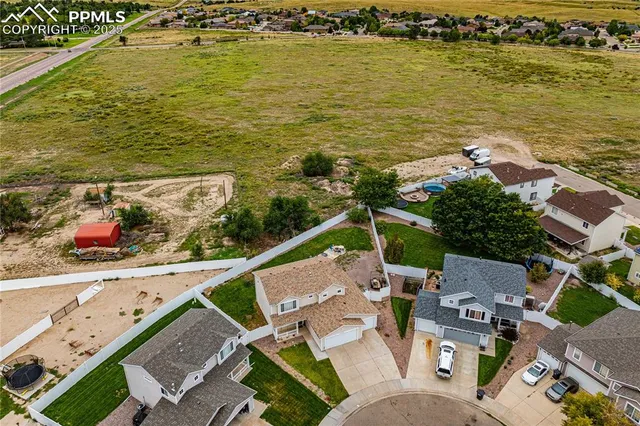 an aerial view of a house with a ocean view
