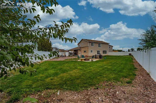 a aerial view of a house with a big yard