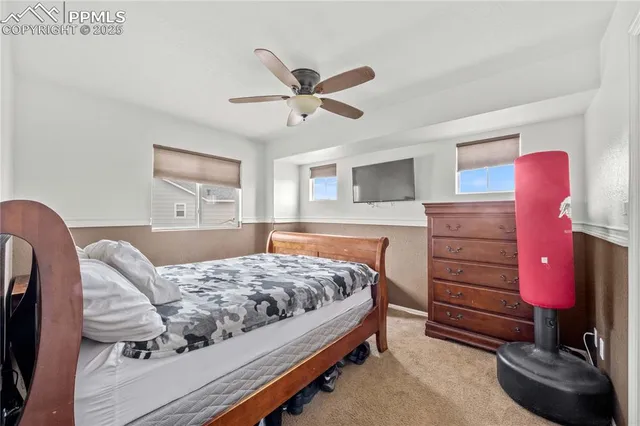 a bedroom with a bed and furniture