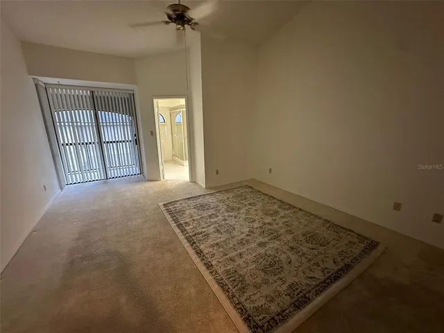 a bathroom with a double vanity sink a toilet and a window