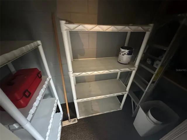 a view of a house with pool garden and sitting area