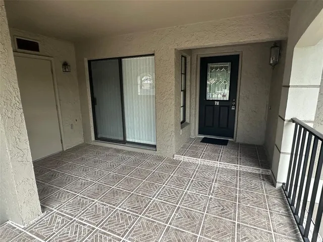 an empty room with entrance and door