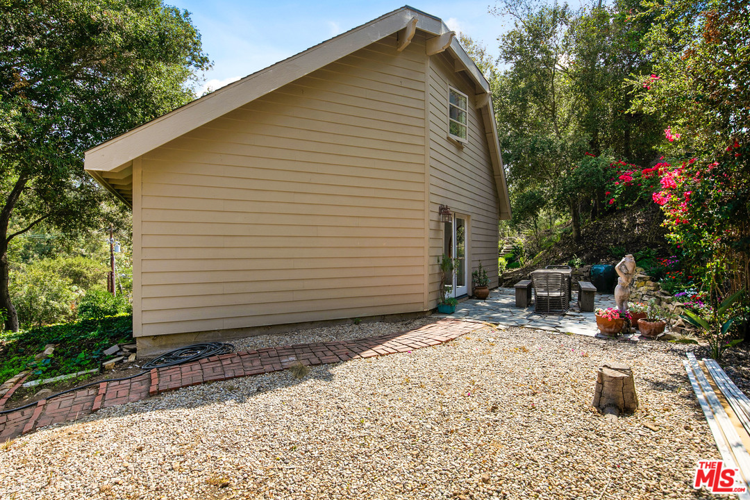 6133 Ramirez Canyon Road Malibu, CA 90265 - Photo 44 of 53 a view of a backyard with sitting area