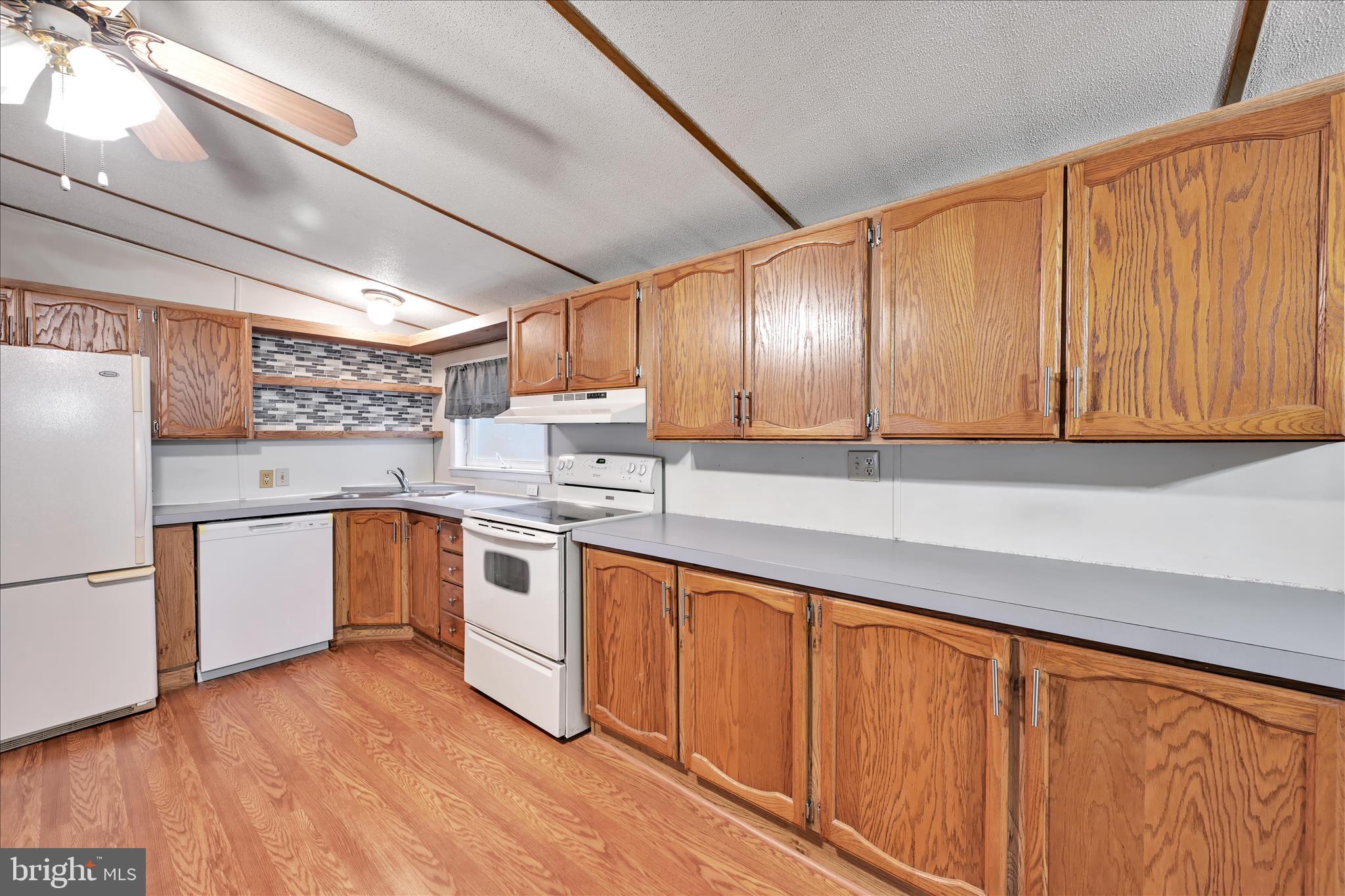 139 Sun Valley Road Elizabethtown, PA 17022 - Photo 15 of 32 a kitchen with stainless steel appliances granite countertop white cabinets a sink and dishwasher