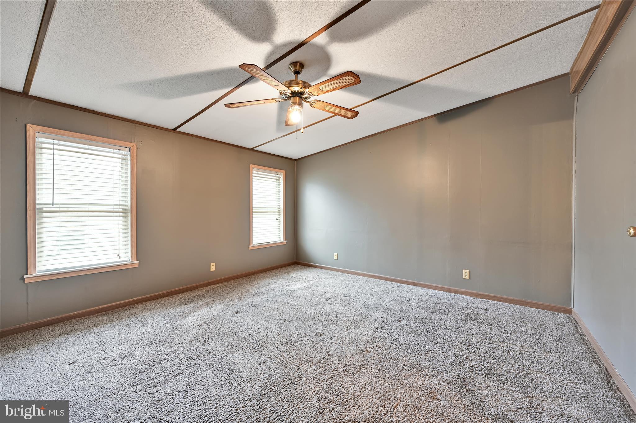 139 Sun Valley Road Elizabethtown, PA 17022 - Photo 18 of 32 a view of an empty room with window and chandelier fan