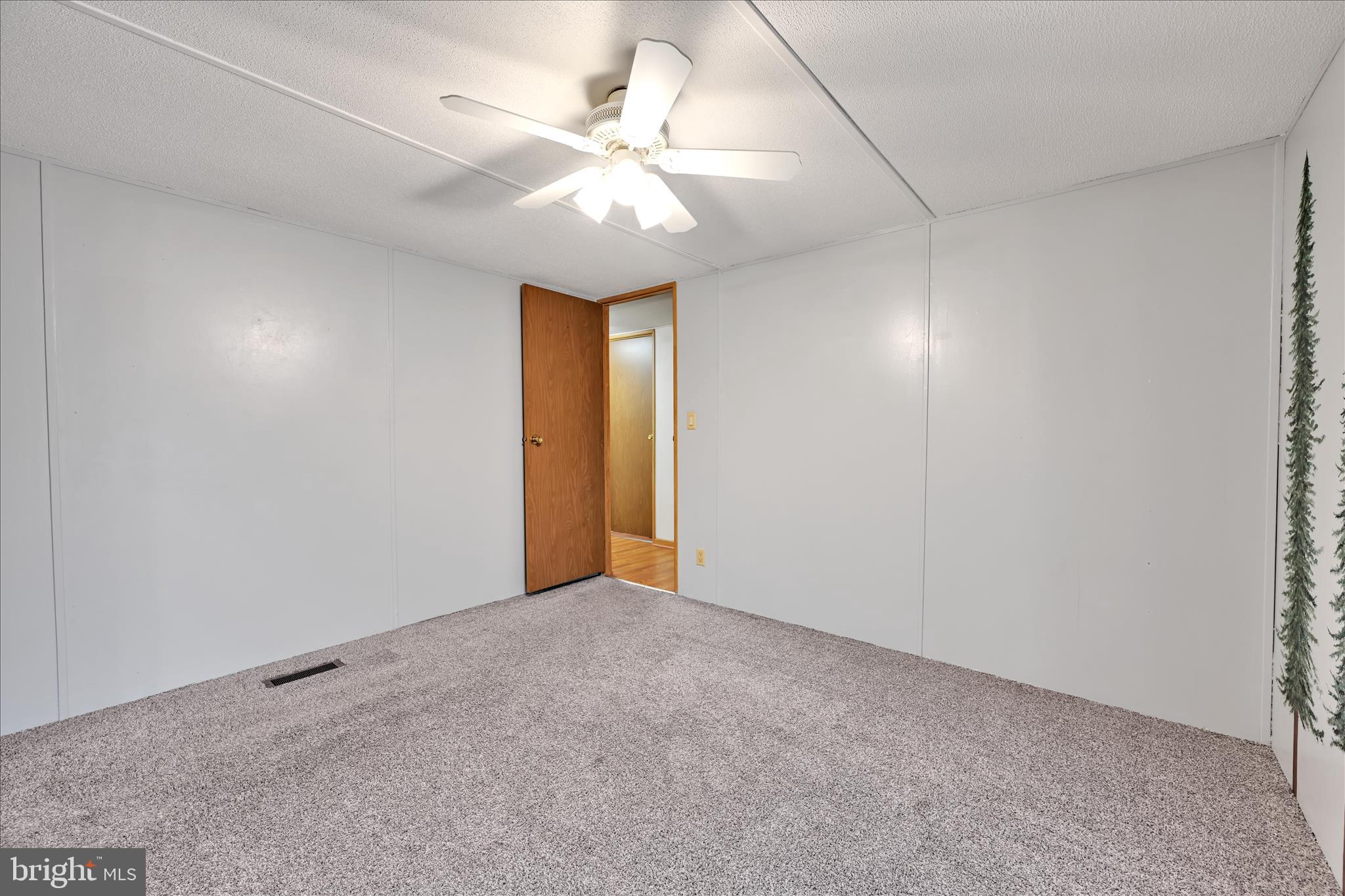 139 Sun Valley Road Elizabethtown, PA 17022 - Photo 23 of 32 a view of an empty room with a chandelier fan