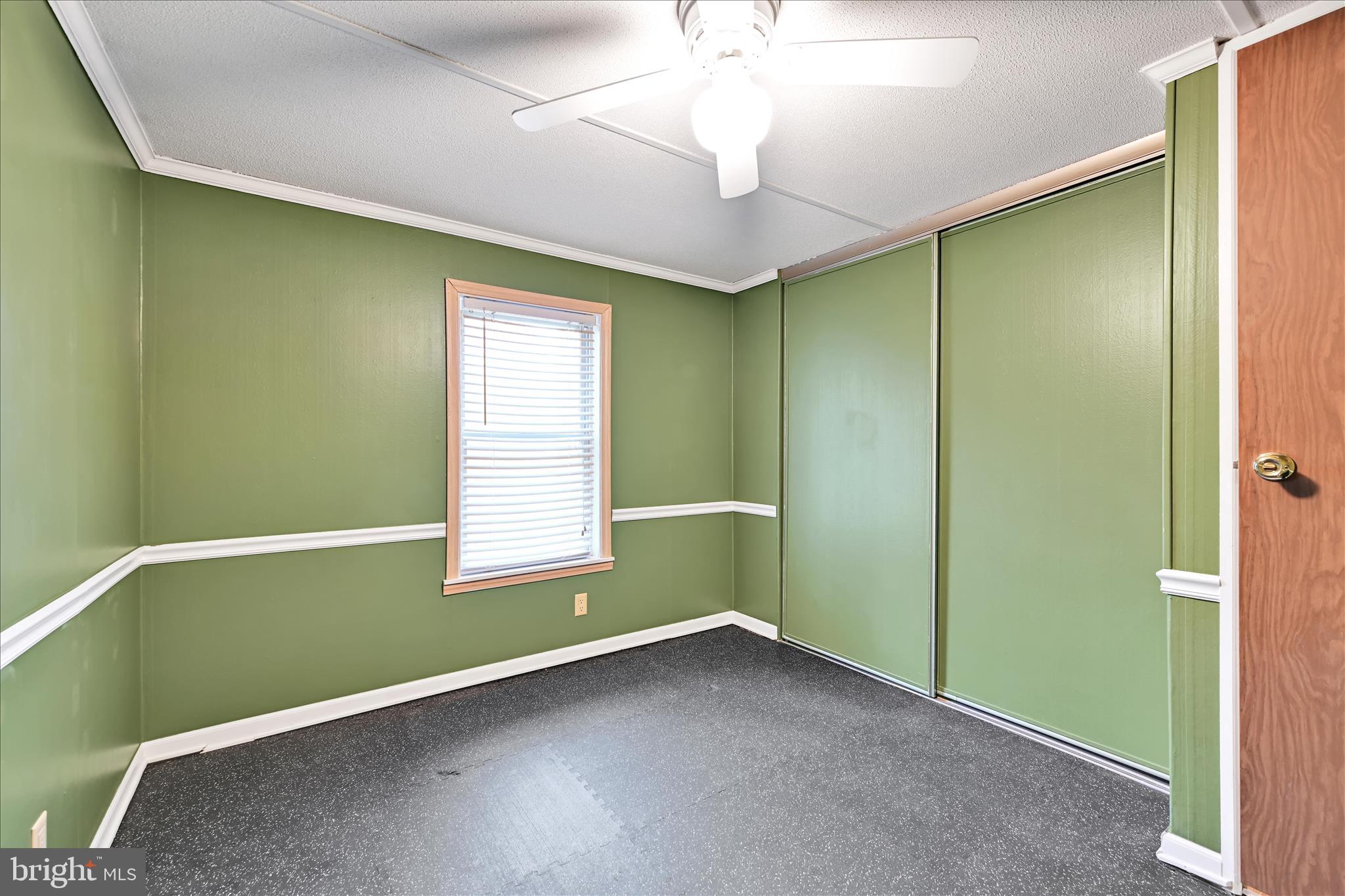 139 Sun Valley Road Elizabethtown, PA 17022 - Photo 25 of 32 an empty room with a window and a chandelier