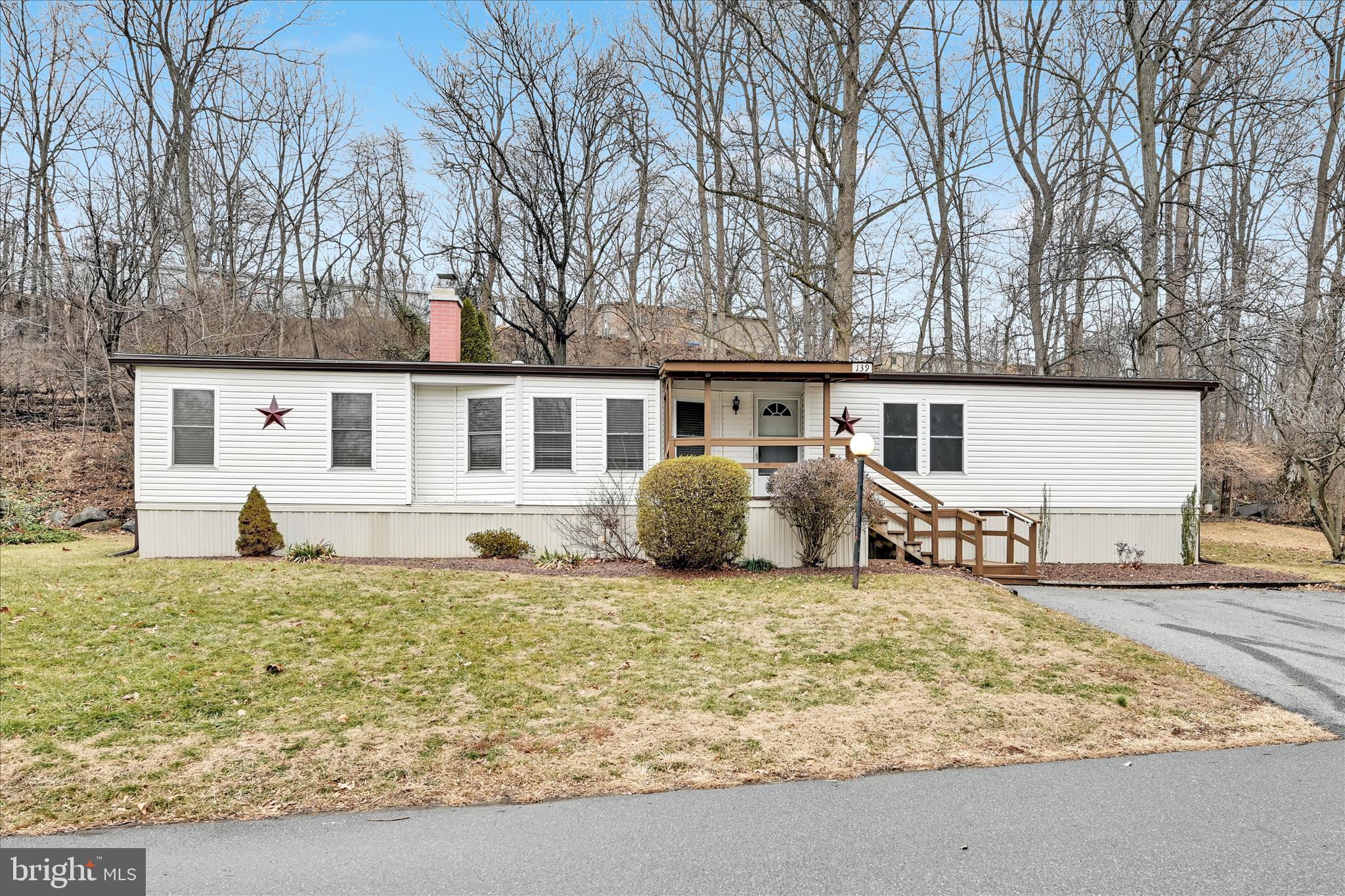 139 Sun Valley Road Elizabethtown, PA 17022 - Photo 3 of 32 a view of a house with a yard and sitting area