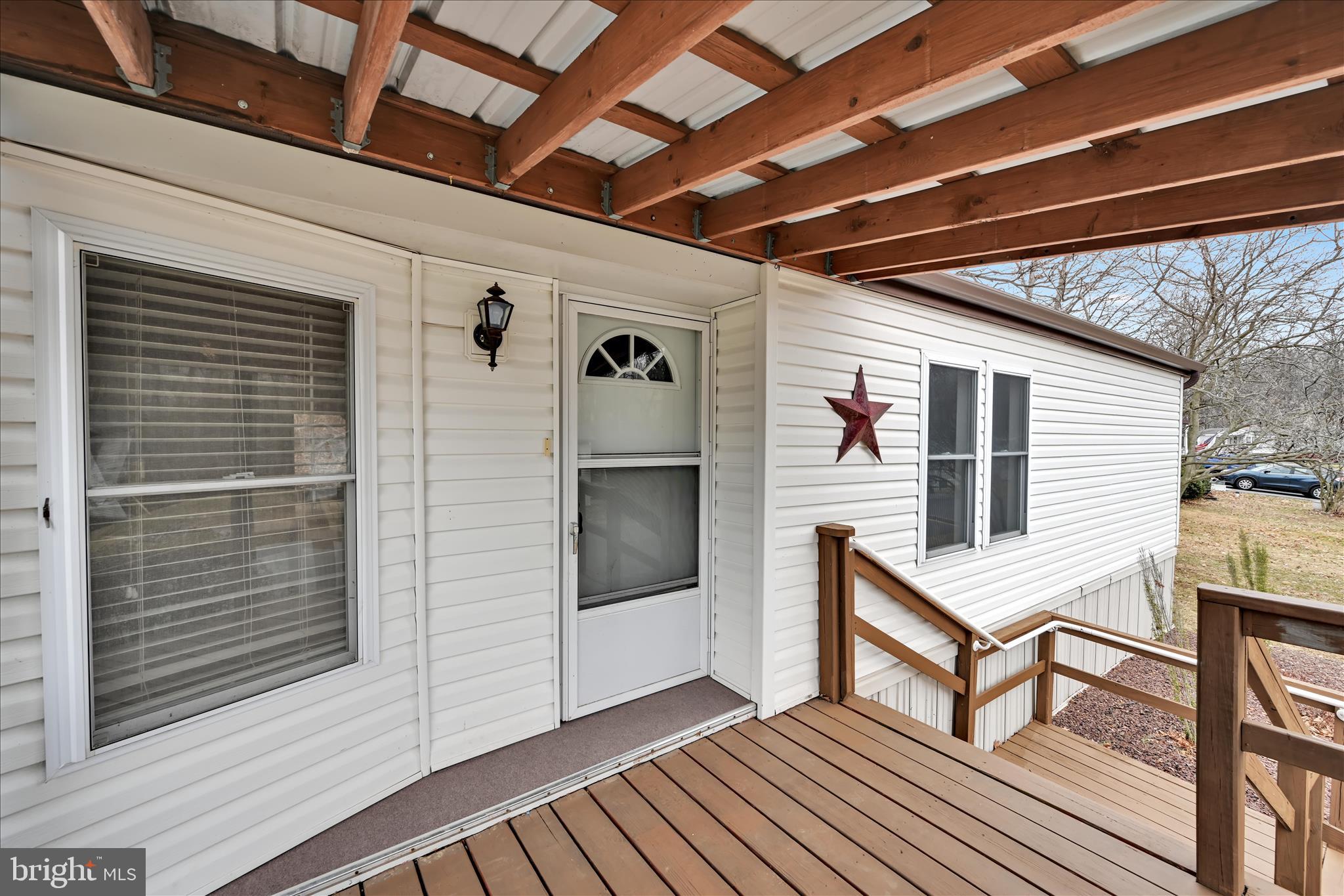 139 Sun Valley Road Elizabethtown, PA 17022 - Photo 7 of 32 a view of a porch with furniture and a flat screen tv