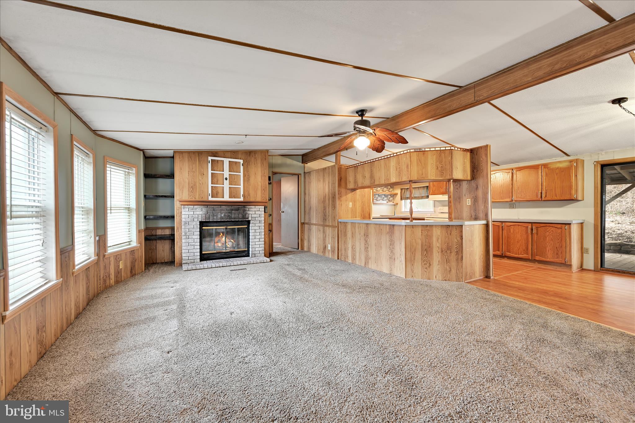 139 Sun Valley Road Elizabethtown, PA 17022 - Photo 8 of 32 a view of an empty room with a fireplace and a window