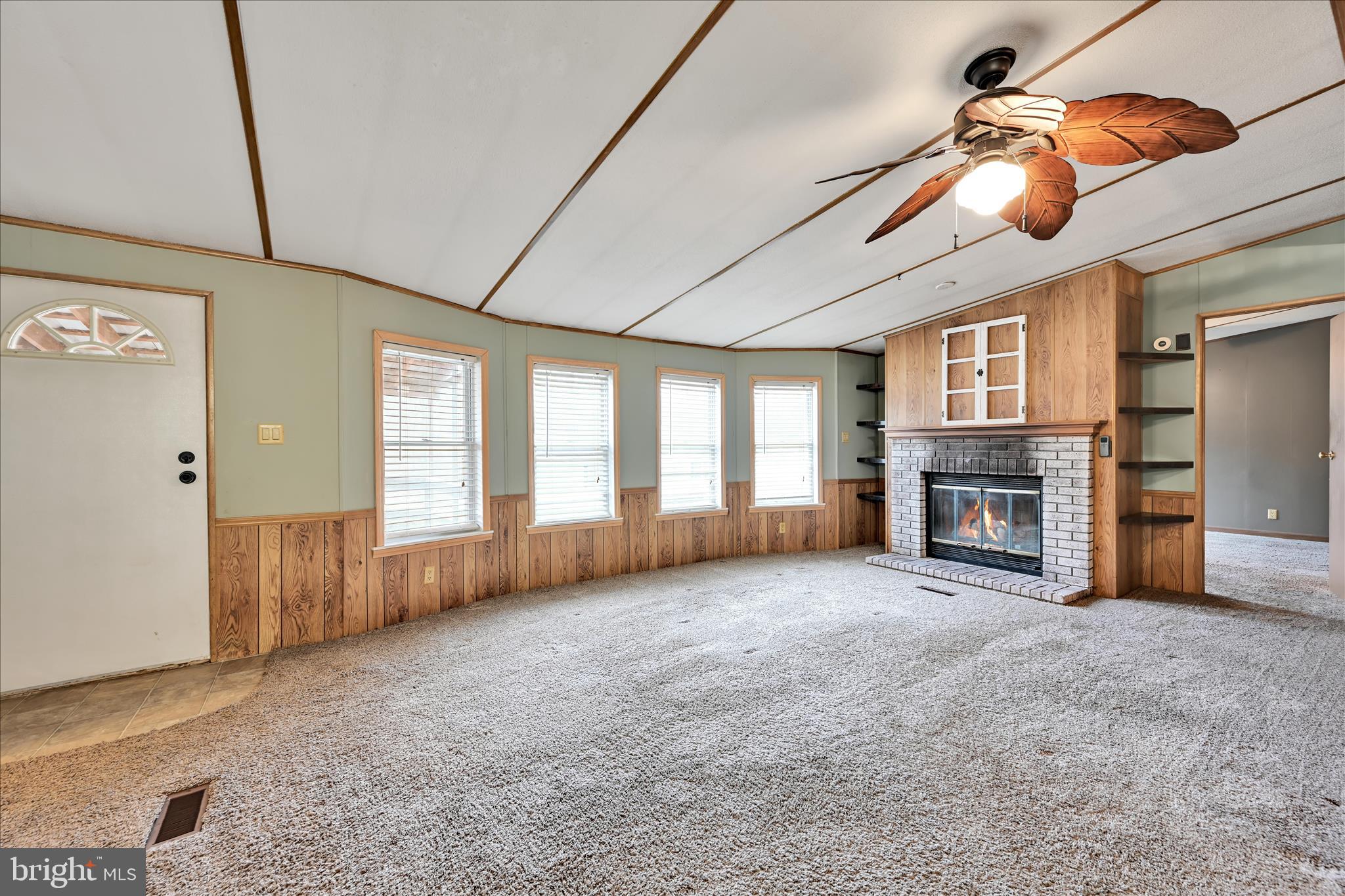 139 Sun Valley Road Elizabethtown, PA 17022 - Photo 9 of 32 a view of an empty room with a fireplace and a window