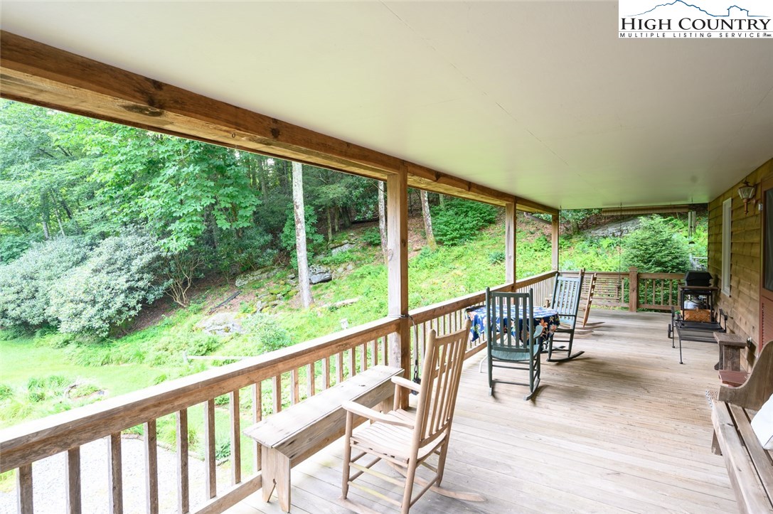 4081 Howard's Creek Road Boone, NC 28607 - Photo 40 of 44 a view of two chairs in a balcony