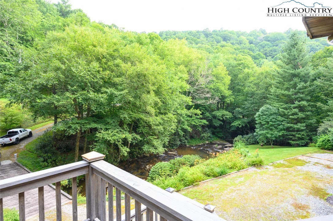 4081 Howard's Creek Road Boone, NC 28607 - Photo 42 of 44 a view of a forest from a balcony