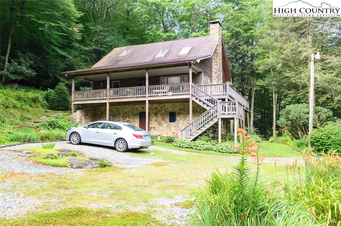 4081 Howard's Creek Road Boone, NC 28607 - Photo 43 of 44 a house view with a garden space