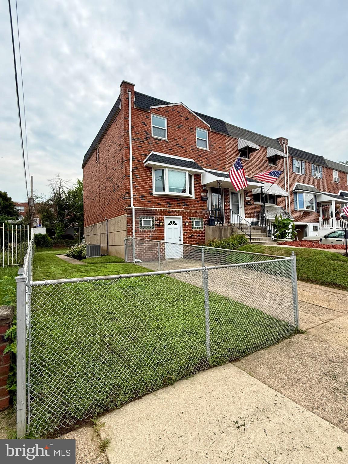 12820 Elnora Road Philadelphia, PA 19154 - Photo 2 of 31 Charming brick home with American flags.