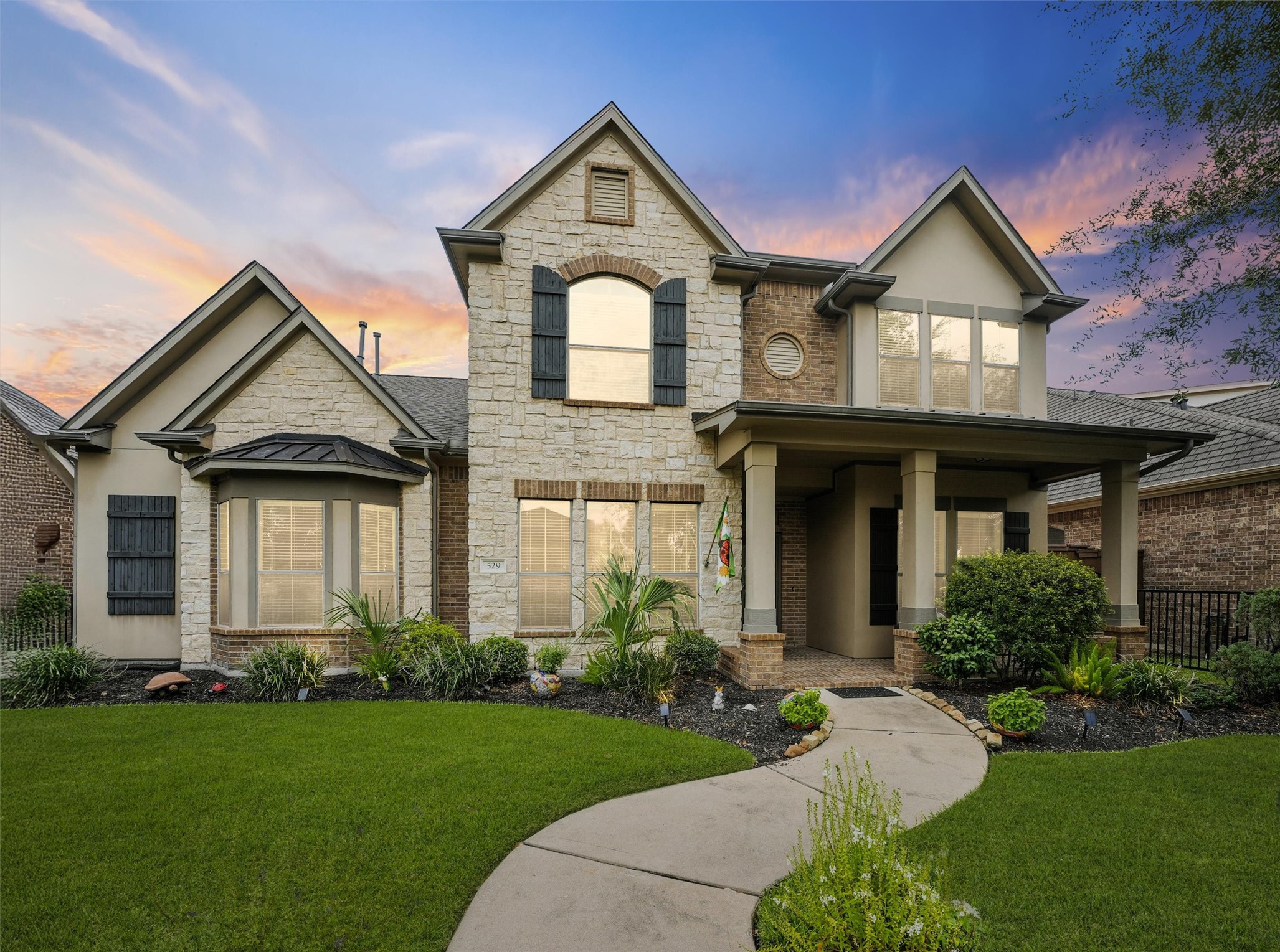 Welcome to 592 Water St. The exterior provides a beautiful combination of stone and brick.