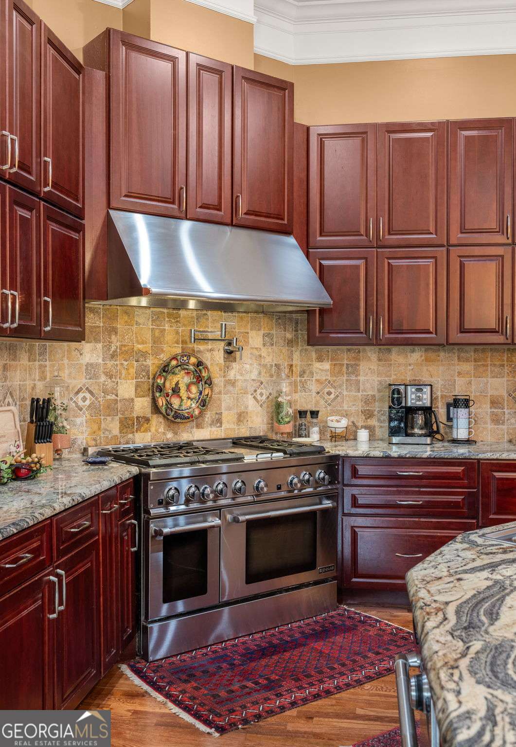265 Honeysuckle Lane Temple, GA 30179 - Photo 14 of 46 a kitchen with granite countertop wooden cabinets and stainless steel appliances