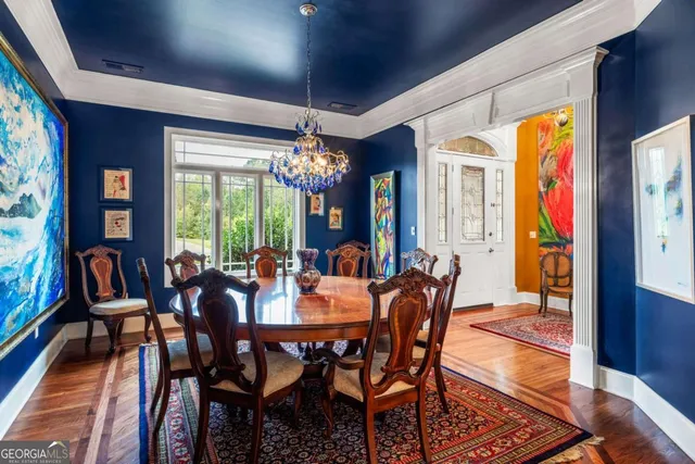 a view of a dining room with furniture window and wooden floor