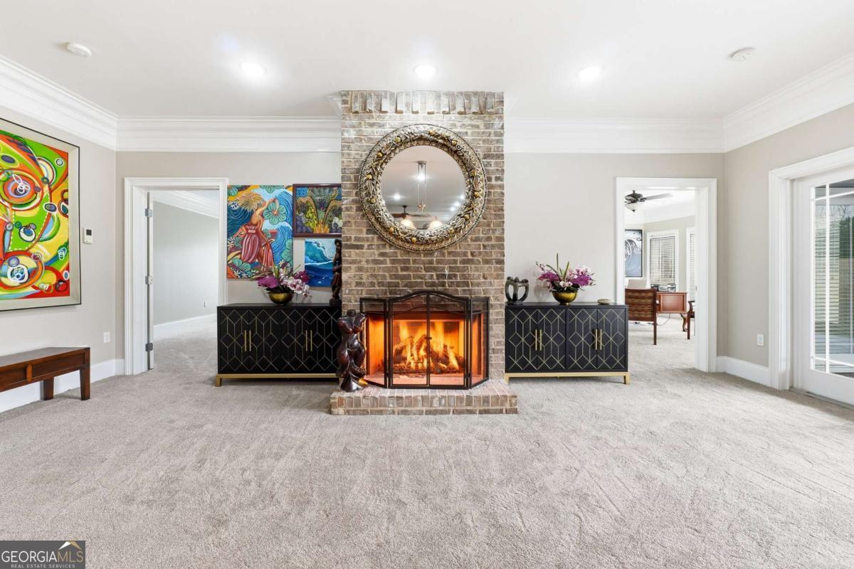 265 Honeysuckle Lane Temple, GA 30179 - Photo 27 of 46 a living room with furniture a flat screen tv and a fireplace