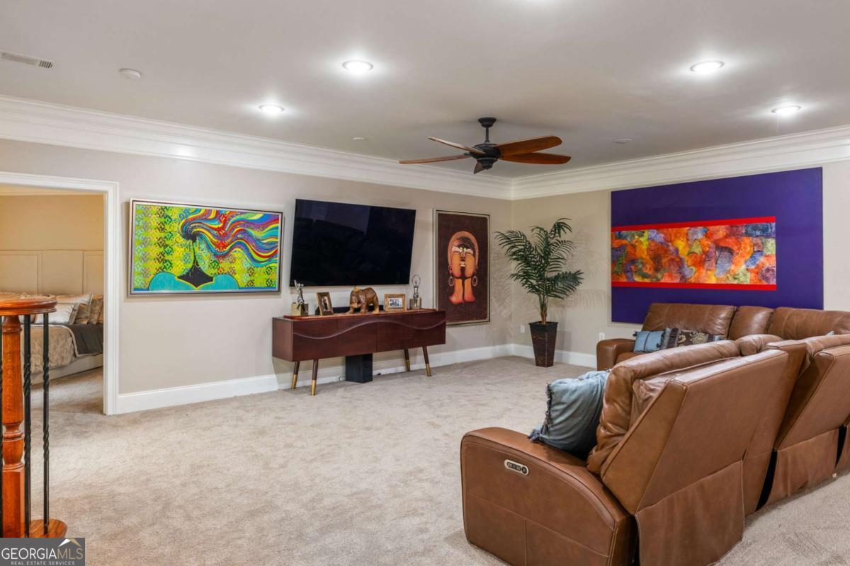 265 Honeysuckle Lane Temple, GA 30179 - Photo 29 of 46 a living room with furniture and a flat screen tv
