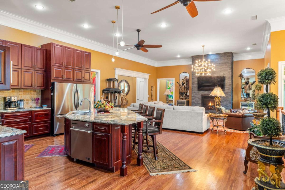 265 Honeysuckle Lane Temple, GA 30179 - Photo 4 of 46 a view of kitchen with stainless steel appliances granite countertop a stove and a refrigerator