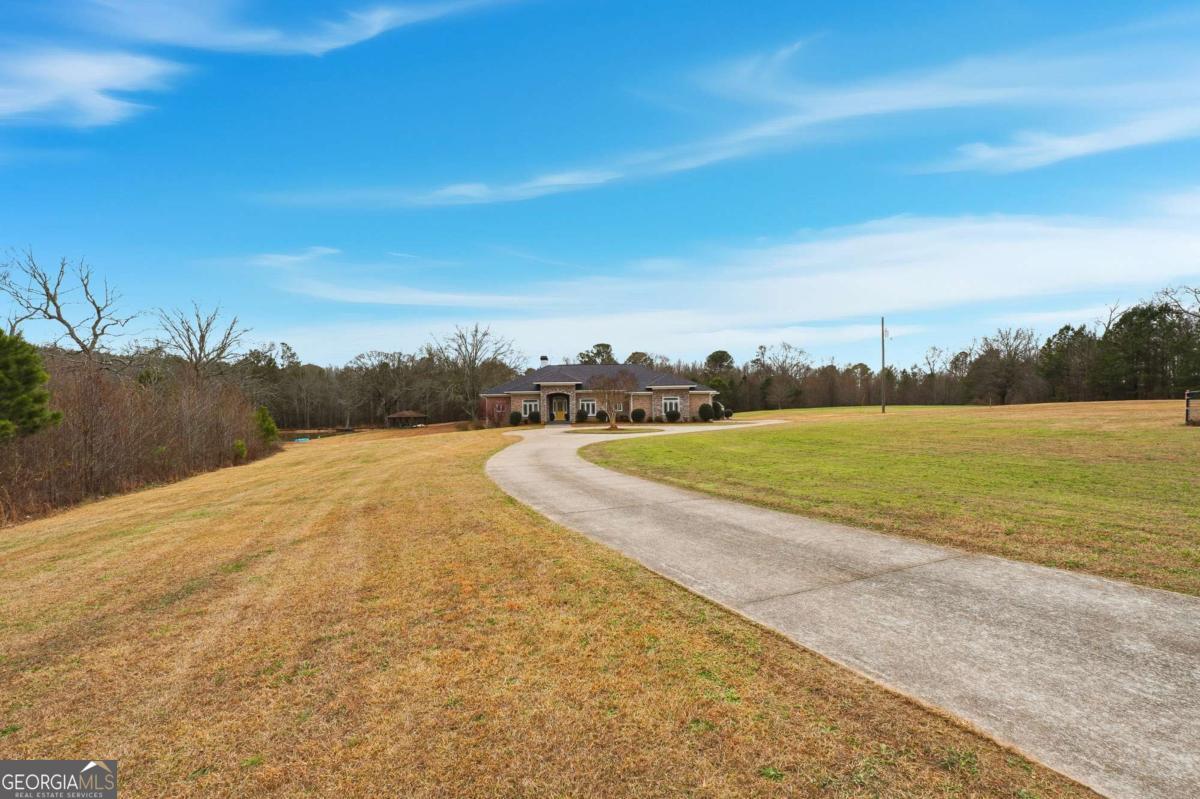 265 Honeysuckle Lane Temple, GA 30179 - Photo 44 of 46 a view of a lake with a city view