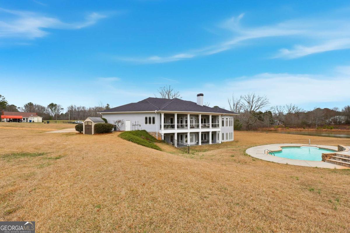 265 Honeysuckle Lane Temple, GA 30179 - Photo 46 of 46 a view of a house with swimming pool and sitting area
