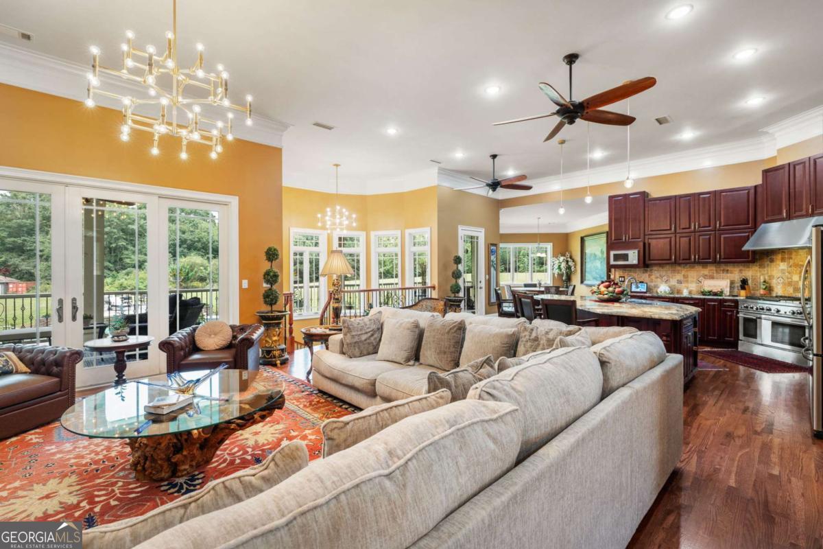 265 Honeysuckle Lane Temple, GA 30179 - Photo 7 of 46 a living room with furniture kitchen and a large window