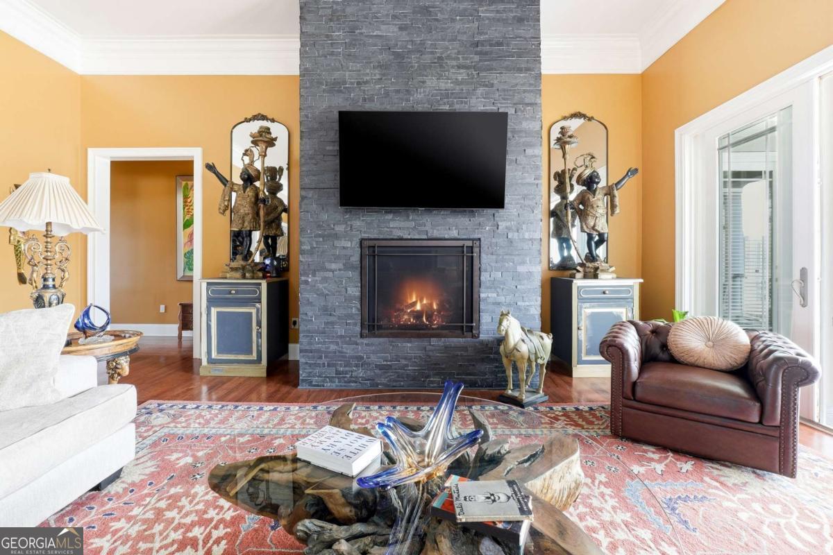 265 Honeysuckle Lane Temple, GA 30179 - Photo 10 of 46 a living room with furniture and a fireplace