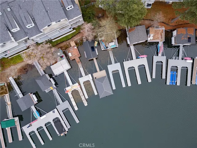 an aerial view of residential house with parking