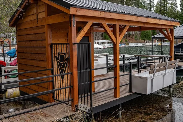 a view of a patio with table and chairs under an umbrella