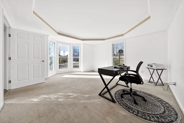 a livingroom with furniture and a window