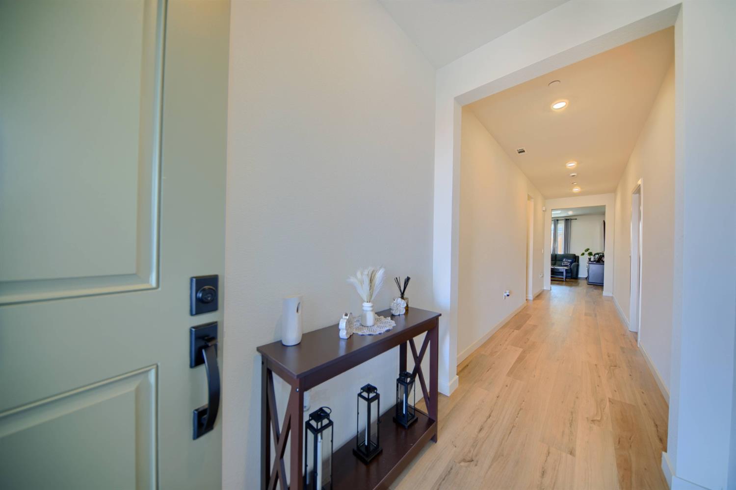 2132 Emerald Rnch Road Patterson, CA 95363 - Photo 15 of 66 a view of a hallway with wooden floor and staircase